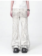 The Distressed Wing Patch Flare Jeans