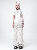 The Distressed Wing Patch Flare Jeans