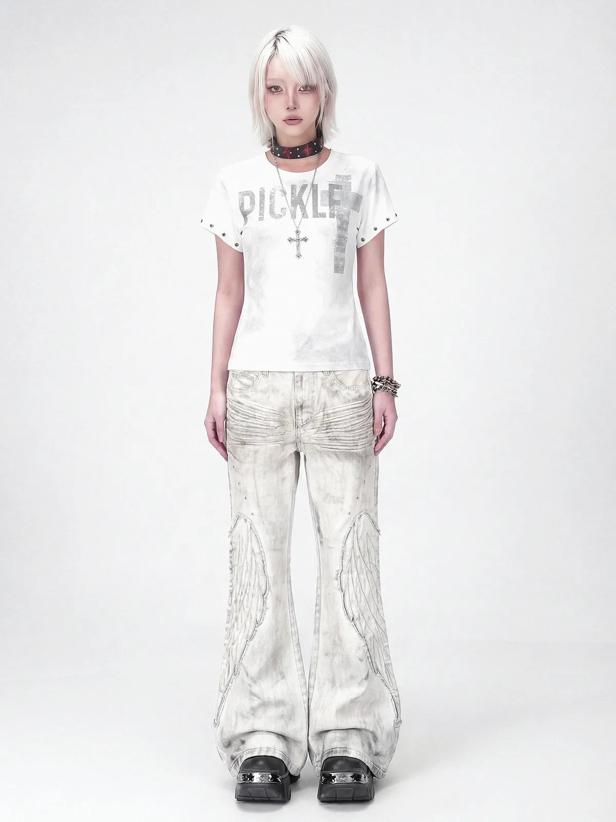 The Distressed Wing Patch Flare Jeans