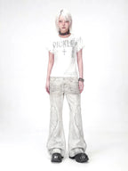 The Distressed Wing Patch Flare Jeans