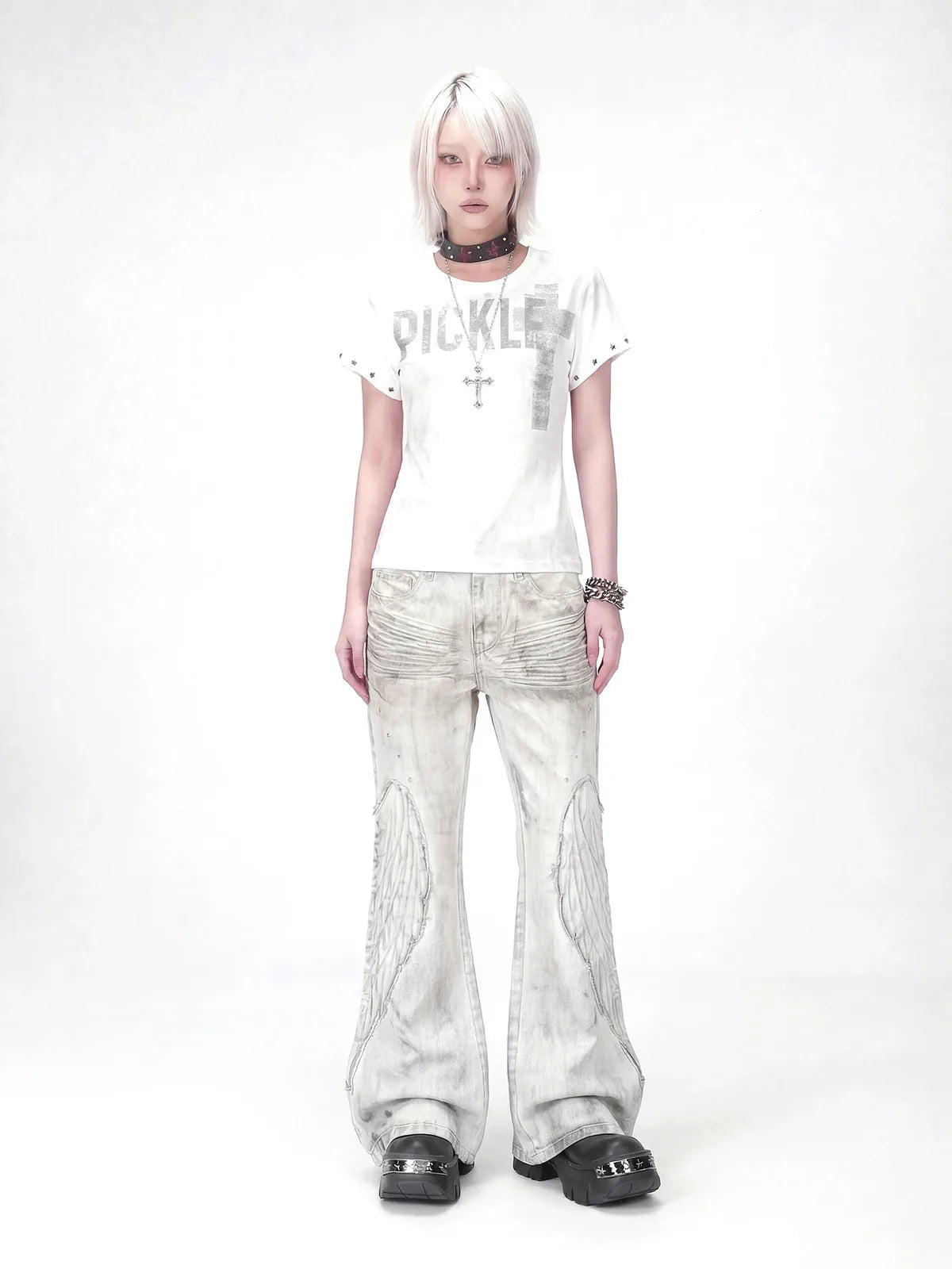 The Distressed Wing Patch Flare Jeans